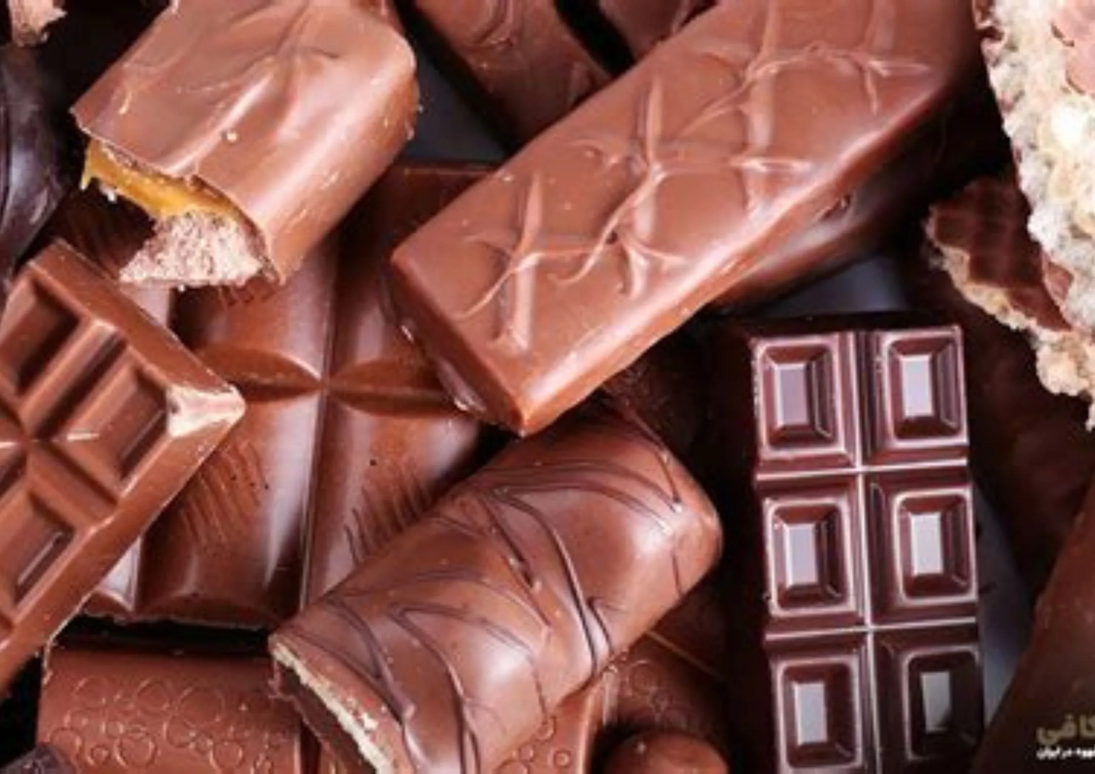 A pile of chocolate barsDescription automatically generated